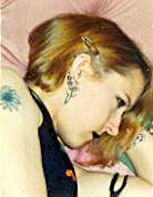 Mandi Apple sporting her Cardiacs daisy tattoo with pride
